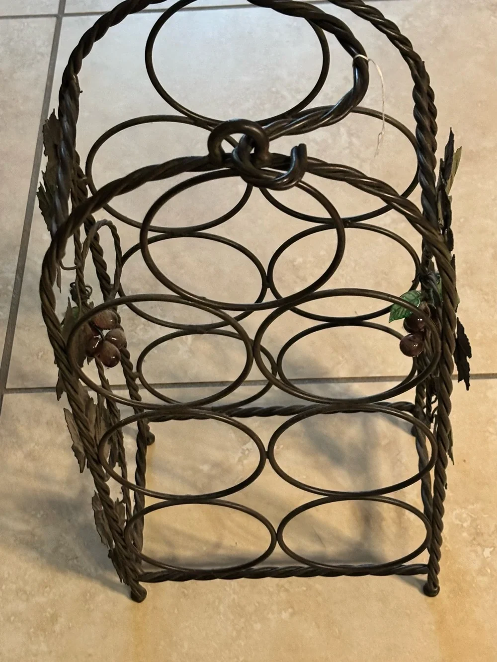 Black Metal Wine Bottle Rack with Decorative Leaf Accents